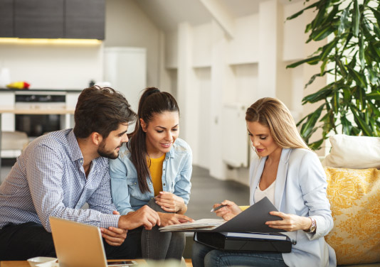insurance rep meeting clients at their home